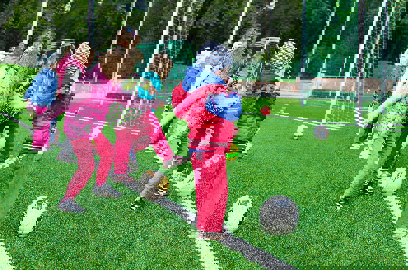 Young children playing football