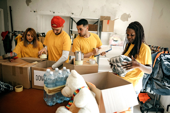 Volunteers sorting donations