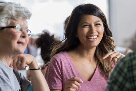 Woman seen through a computer monitor